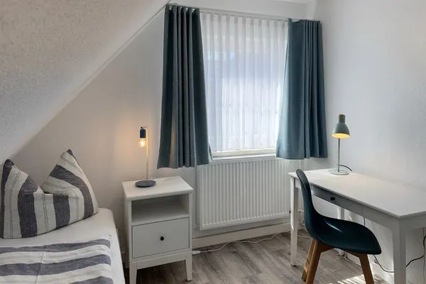 Schlafzimmer Haus Frisia Ferienwohnung Frisia 4