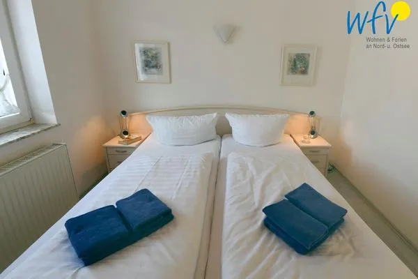 Schlafzimmer Haus vorm Riff Ferienwohnung Memmertfeuer