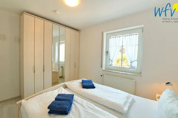 Schlafzimmer Haus vorm Riff Ferienwohnung Memmertfeuer