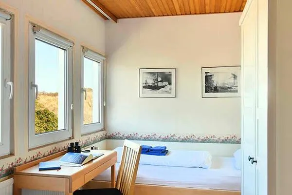 Schlafzimmer Haus am Ginsterpad Ferienwohnung Heckenrose