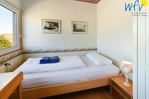 Schlafzimmer Haus am Ginsterpad Ferienwohnung Heckenrose