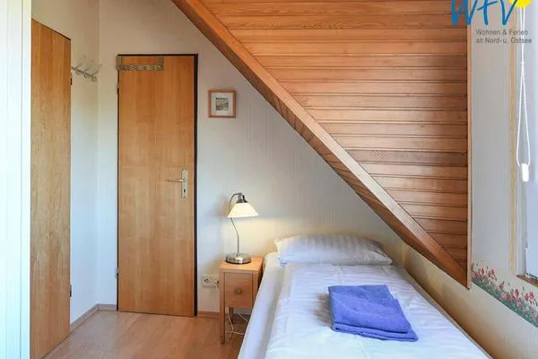 Schlafzimmer Haus am Ginsterpad Ferienwohnung Heckenrose