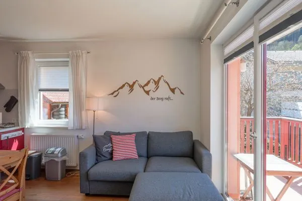 Wohnzimmer mit Zugang Balkon  Dachsteinblick by Alpendyll Apartments