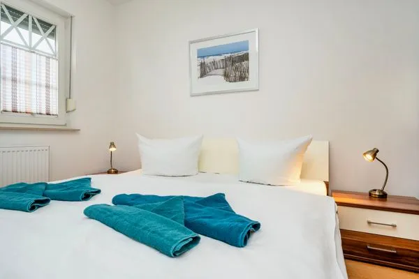 Schlafzimmer mit Doppelbett  Villa Carpe Diem - Wohnung 2