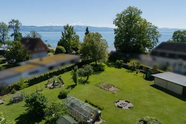 Ferienhaus Kuprella Ferienwohnung Kuprella 2 Nonnenhorn - Blick auf Garten und See