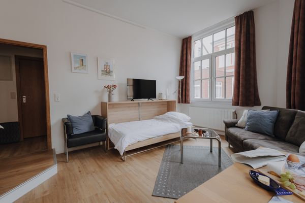  Haus Derk Juist - Wohnung 2 Borkum - Im Wohnzimmer findet ihr ein modernes Murphybett. Getrennt Schlafen ist möglich.