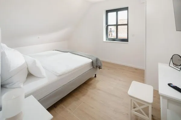 Schlafzimmer  Suite West | Seitliche Wasserlage