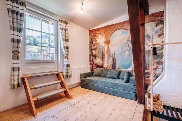 Sleeping Sofa and access to the balcony  KUL  App. 4 by Alpenidyll Apartments