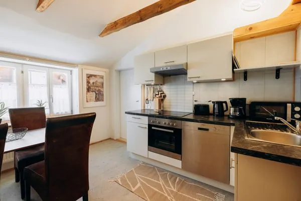 Kitchen and dining area  KUL  App. 4 by Alpenidyll Apartments