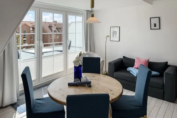 Wohnzimmer  Ferienwohnung „Südspitze 10 mit Meerblick"