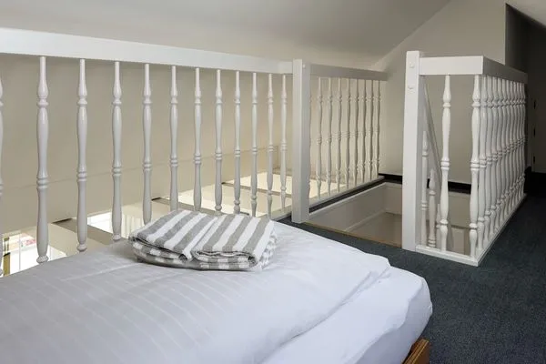 Empore  Ferienwohnung „Südspitze 10 mit Meerblick"