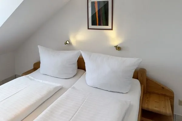 Schlafzimmer  Ferienwohnung „Südspitze 10 mit Meerblick"