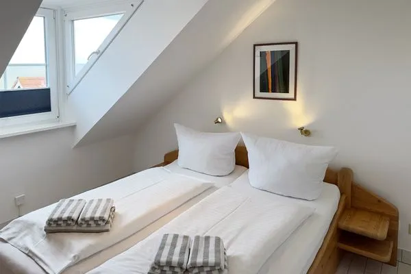Schlafzimmer  Ferienwohnung „Südspitze 10 mit Meerblick"