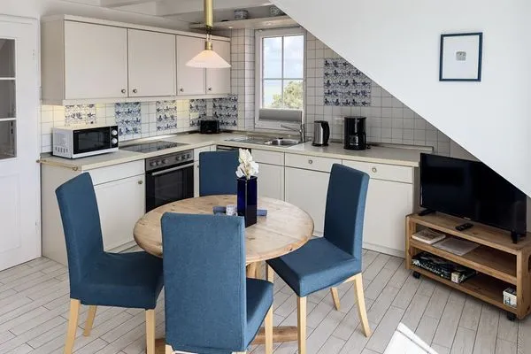 Wohnzimmer  Ferienwohnung „Südspitze 10 mit Meerblick"