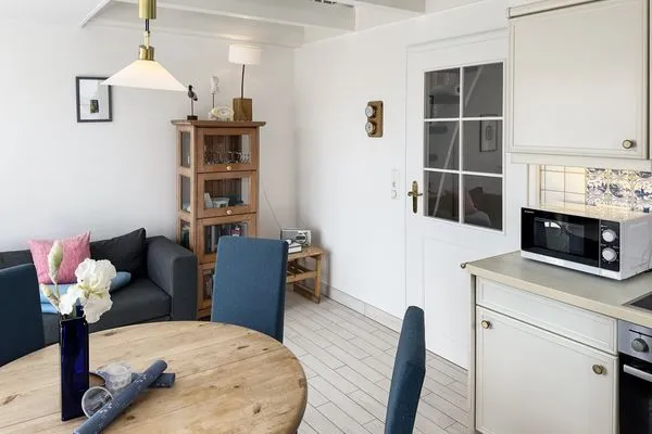 Wohnzimmer  Ferienwohnung „Südspitze 10 mit Meerblick"