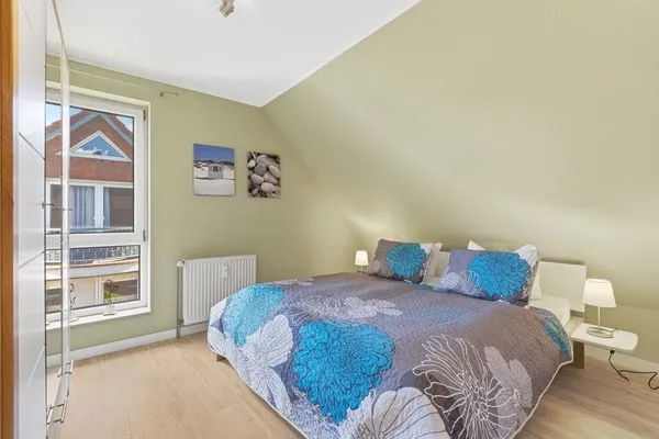 Schlafzimmer mit Doppelbett  Ferienwohnung Seepferdchen