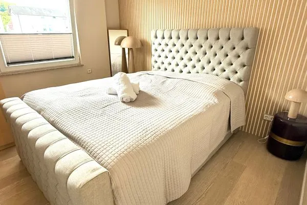 Schlafzimmer  FeWo Fontane - Kamin, Sauna, Meerblick, Badeteich