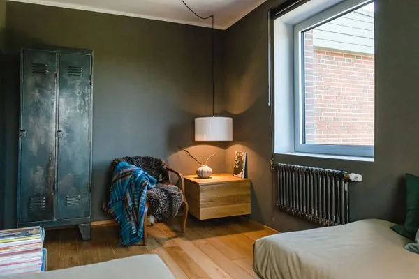 Schlafzimmer im EG mit Sessel  Ferienhaus Friedrich 15