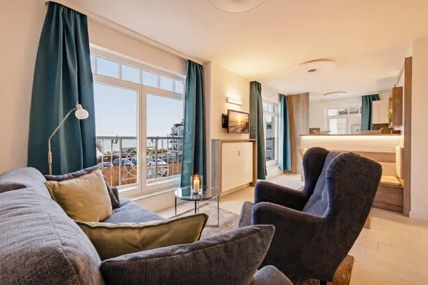 Wohnzimmer  Ferienwohnung Küstenkind direkt am Strand, modern eingerichtet mit Meerblick