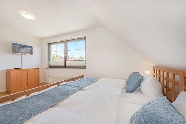 Schlafzimmer  Ferienhaus Sonnendeck mit Sauna, Kamin & Terrasse für 12 Personen