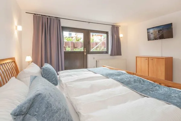 Schlafzimmer  Ferienhaus Sonnendeck mit Sauna, Kamin & Terrasse für 12 Personen