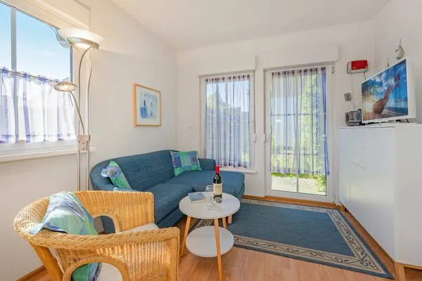 Wohnzimmer  Ferienwohnung Inselnest mit Terrasse & Strandkorb - nur 500 Meter bis zum Strand