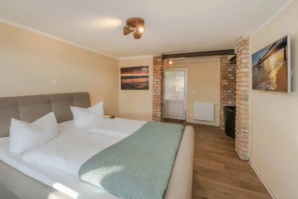 Schlafzimmer  Ferienwohnung Mittschiffs mit Sauna, Whirpool & Garten - nur 500 Meter zum Meer