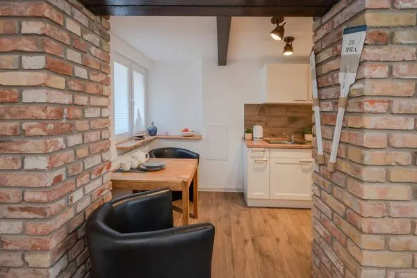 Wohnzimmer  Ferienwohnung Mittschiffs mit Sauna, Whirpool & Garten - nur 500 Meter zum Meer