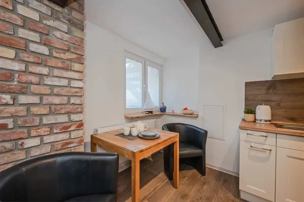 Wohnzimmer  Ferienwohnung Mittschiffs mit Sauna, Whirpool & Garten - nur 500 Meter zum Meer
