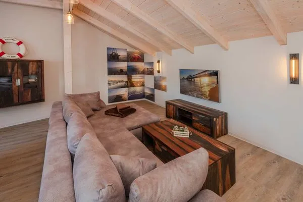 Wohnzimmer  Apartment Brücke mit Garten, Sauna & Hot-Tube - nur 500 Meter zum Strand