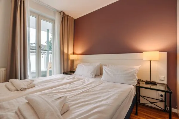 Ferienwohnung Deichkieker Aparthotel Zingst - Schlafzimmer  Deichkieker