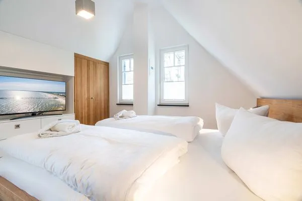 Schlafzimmer  Ferienhaus Baltic Huus mit Sauna, Kamin und Sonnenterrasse