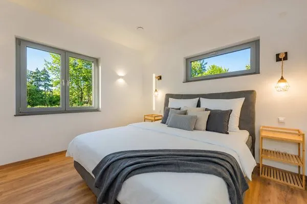 Schlafzimmer  Ferienhaus "Haffhus" mit Balkon, Terrasse und 2 Bädern