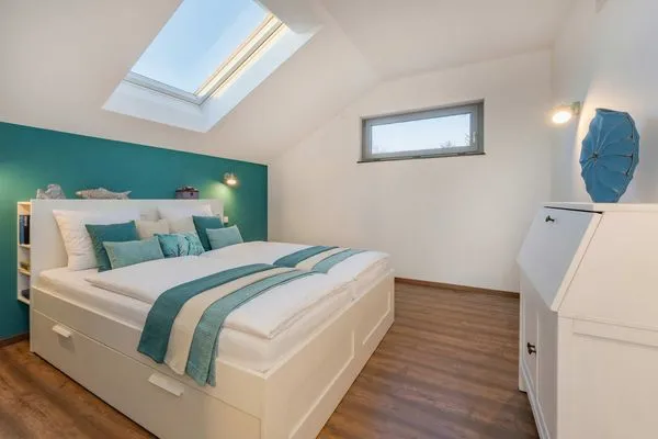Schlafzimmer  Ferienhaus "Haffhus" mit Balkon, Terrasse und 2 Bädern