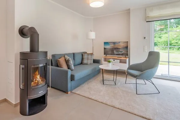Wohnzimmer  Ferienhaus Haffglück mit Sauna, Kamin und Terrasse mit Haffblick