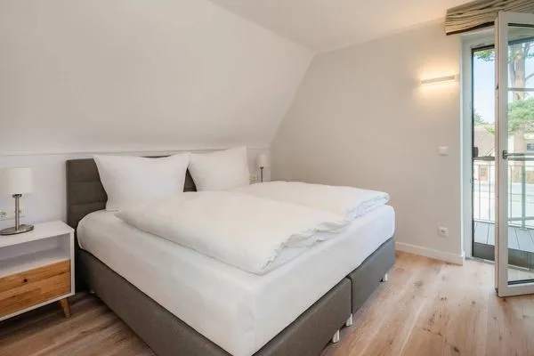 Schlafzimmer  Ferienhaus Haffglück mit Sauna, Kamin und Terrasse mit Haffblick