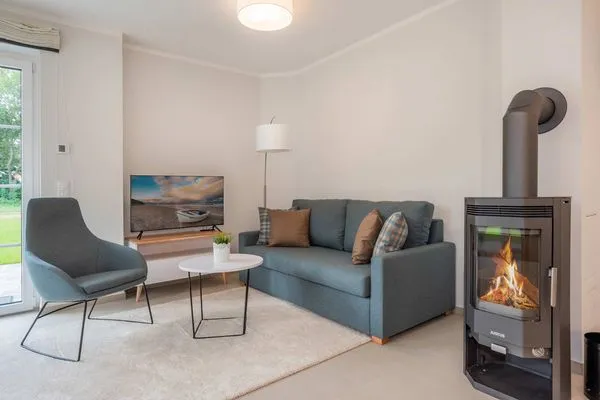 Wohnzimmer  Ferienhaus Haff-Traum mit Kamin, Sauna und Terrasse