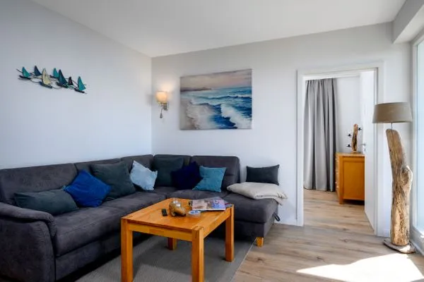 Wohnzimmer  FeWo Tag am Meer - Kamin, Sauna, Meerblick