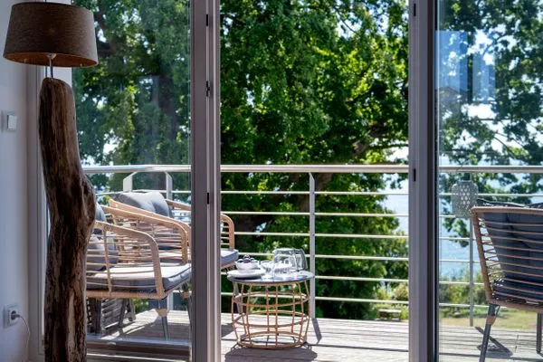 Wohnzimmer  FeWo Tag am Meer - Kamin, Sauna, Meerblick