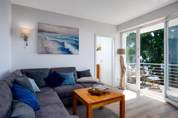 Wohnzimmer  FeWo Tag am Meer - Kamin, Sauna, Meerblick