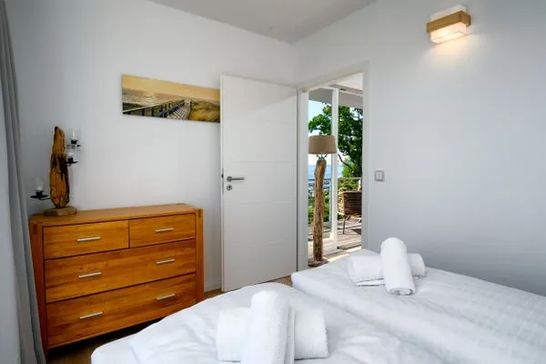 Schlafzimmer  FeWo Tag am Meer - Kamin, Sauna, Meerblick
