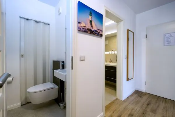Gäste-WC  FeWo Tag am Meer - Kamin, Sauna, Meerblick