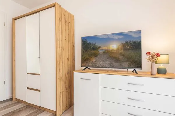 Schlafzimmer  Ferienwohnung Haffkoje Fitness, Sauna und Kinderspielbereich