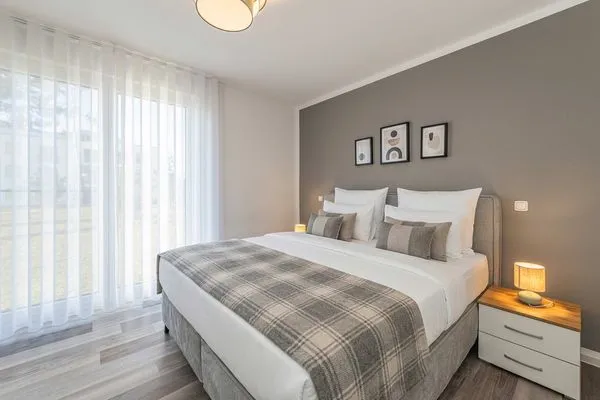Schlafzimmer  Ferienwohnung Haffkoje Fitness, Sauna und Kinderspielbereich