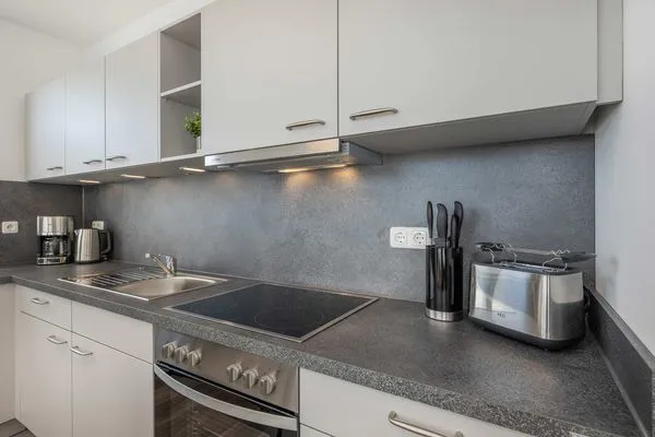 Küche / Küchenzeile  Ferienwohnung Haffkoje Fitness, Sauna und Kinderspielbereich