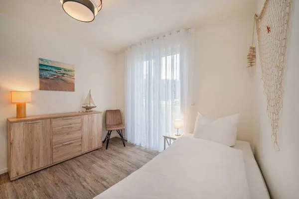 Schlafzimmer  Ferienwohnung Klippenblick mit Sauna, Kinderspielbereich und Fitnessraum