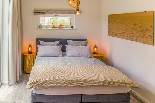Schlafzimmer  Ferienhaus Reethäus'l mit Whirlpool, Sauna, Kamin und Terrasse
