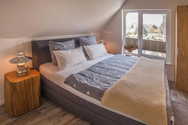 Schlafzimmer  Ferienhaus Reethäus'l mit Whirlpool, Sauna, Kamin und Terrasse