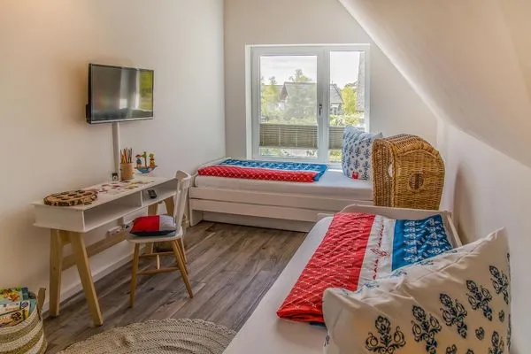 Schlafzimmer  Ferienhaus Reethäus'l mit Whirlpool, Sauna, Kamin und Terrasse