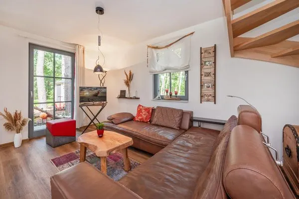 Wohnzimmer  Ferienhaus Auszeitfischer mit Sauna, Kamin und Terrasse